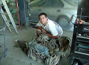 Man and a Vehicle Engine