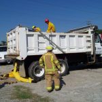 Firemen on Dump Truck